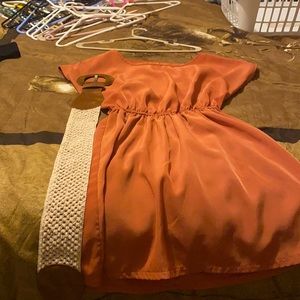 Rust color mini dress with crocheted and Swede belt.